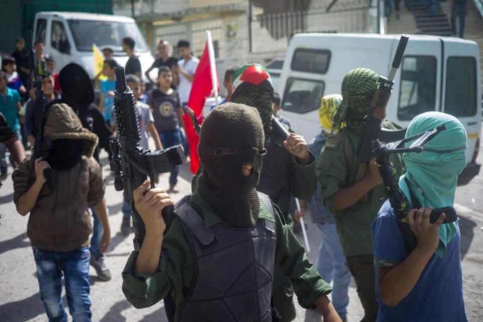 Youths with toy guns attend the funeral of Ahmad Sharake who was shot during clashes with Israeli forces Sunday in Jelazun refugee camp October 12 2015. Ilia Yefimovich Getty Images